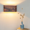 Wood sconce from curved rosewood veneer