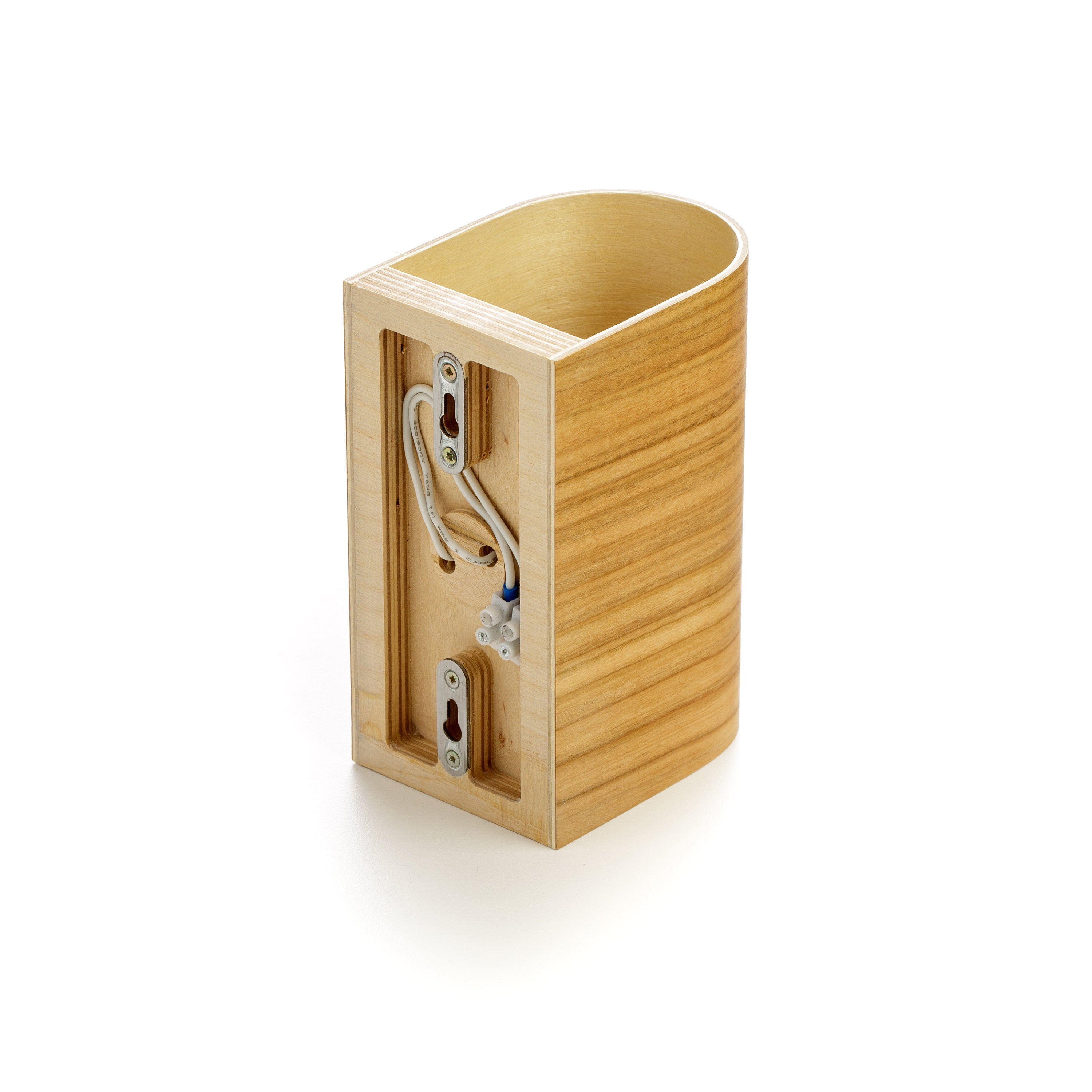 Modern wood wall sconce providing warm decorative lighting