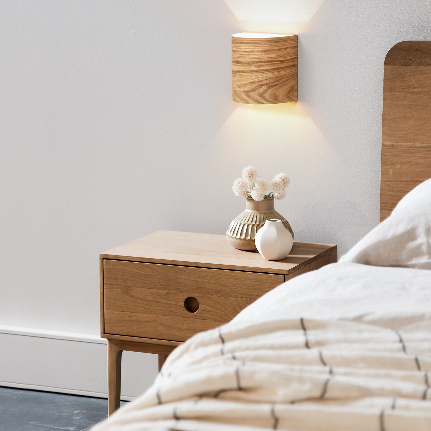 Square ash UL listed wall sconce mounted on a wall