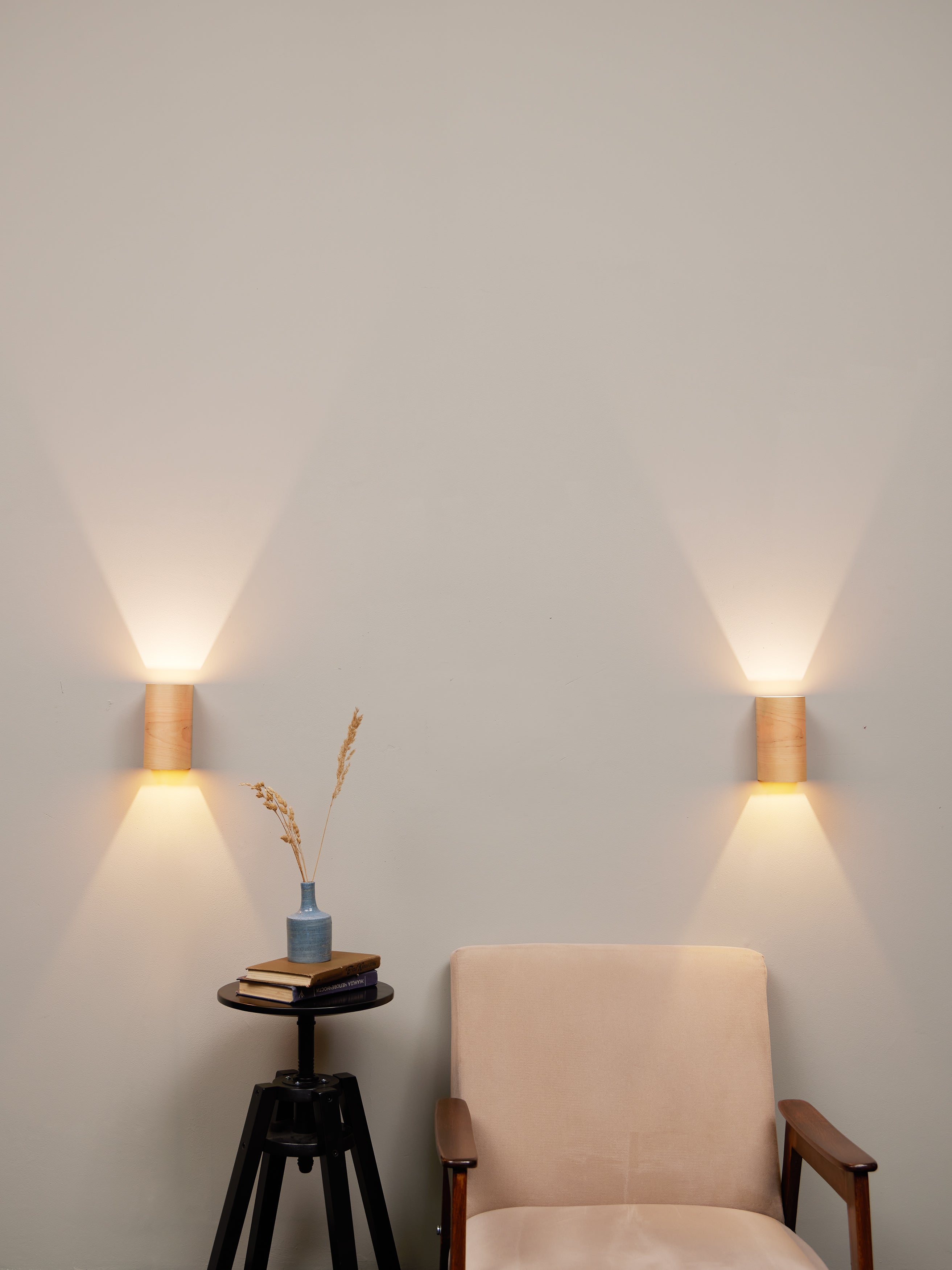 Birch wall lamps with warm glow