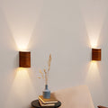 Set of 2 etimoe wall sconces on a wall