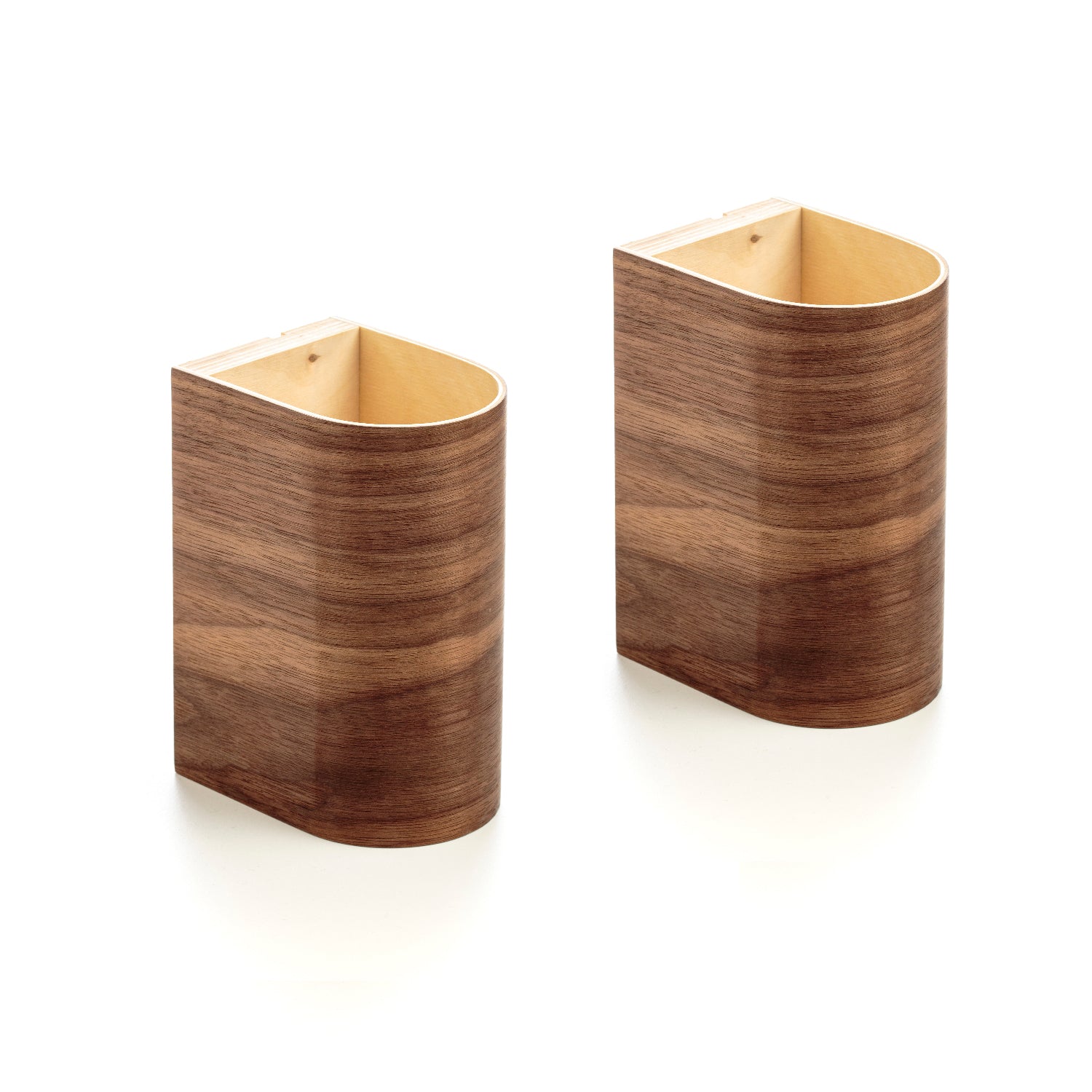 Pair of wall mounted wood light fixtures on a wall
