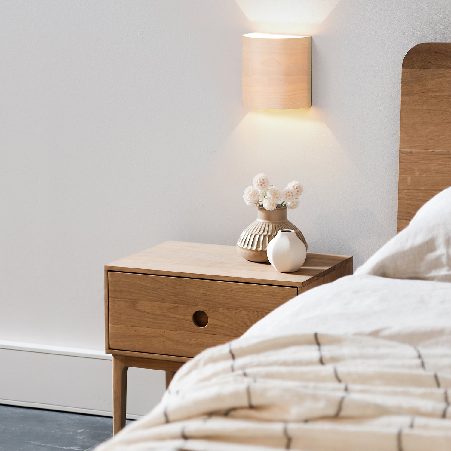 UL listed birch wall sconce mounted on a wall