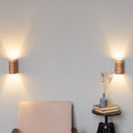 Set of 2 ash wall sconces on a wall