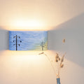Compact hand-painted accent light mounted on a wall