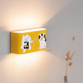 Hand-painted cat wall lamp mounted on a wall