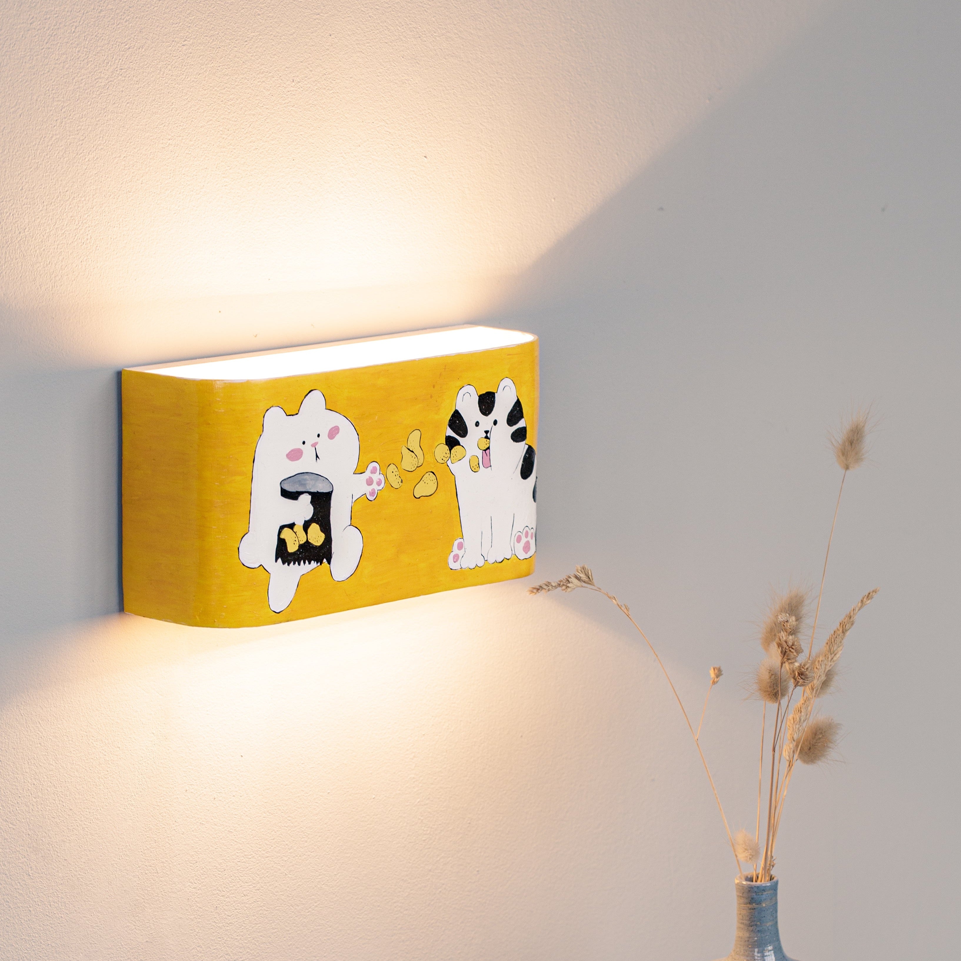 Hand-painted cat wall lamp mounted on a wall
