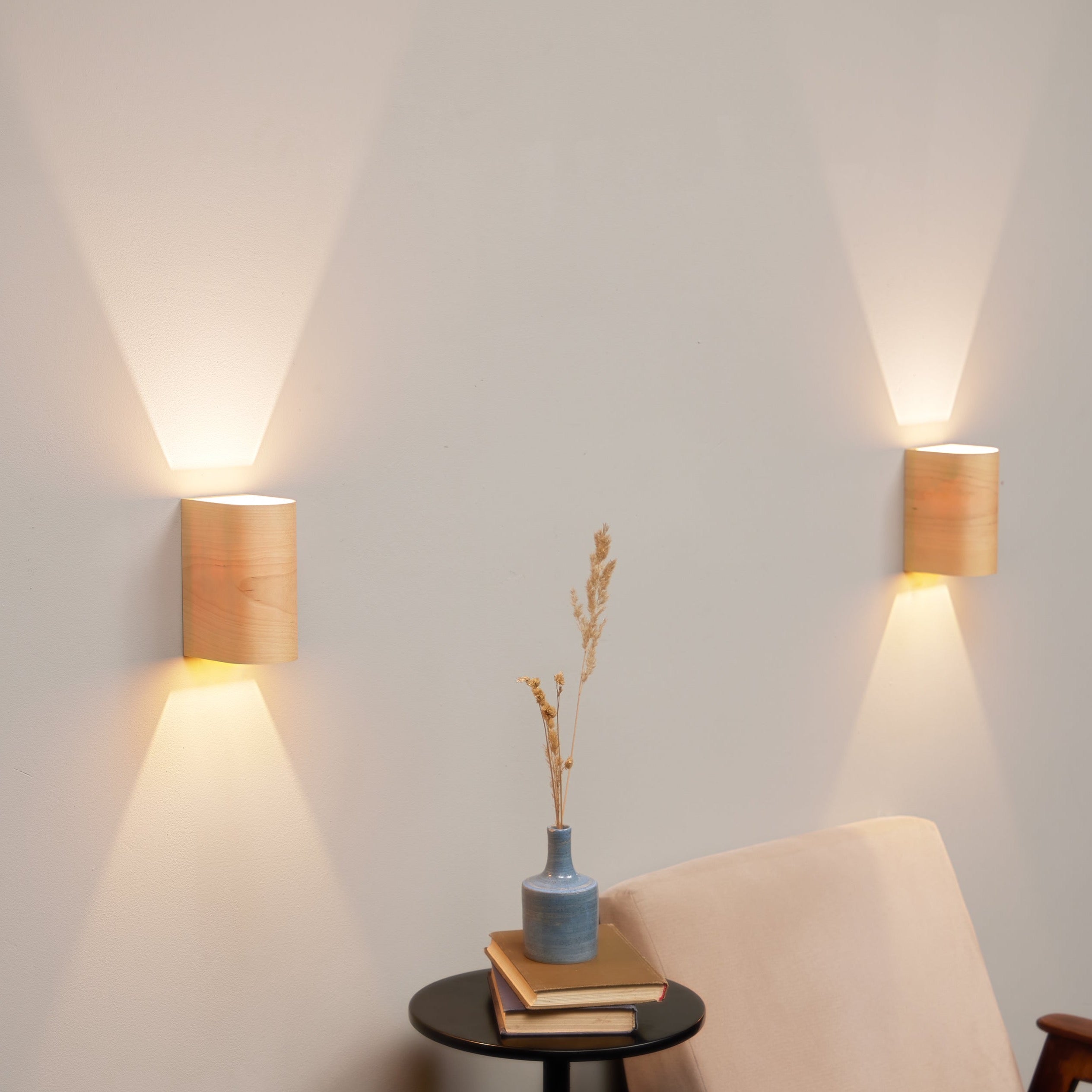 Set of 2 birch wall sconces on a wall