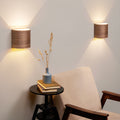 Set of 2 premium walnut wall sconces on a wall