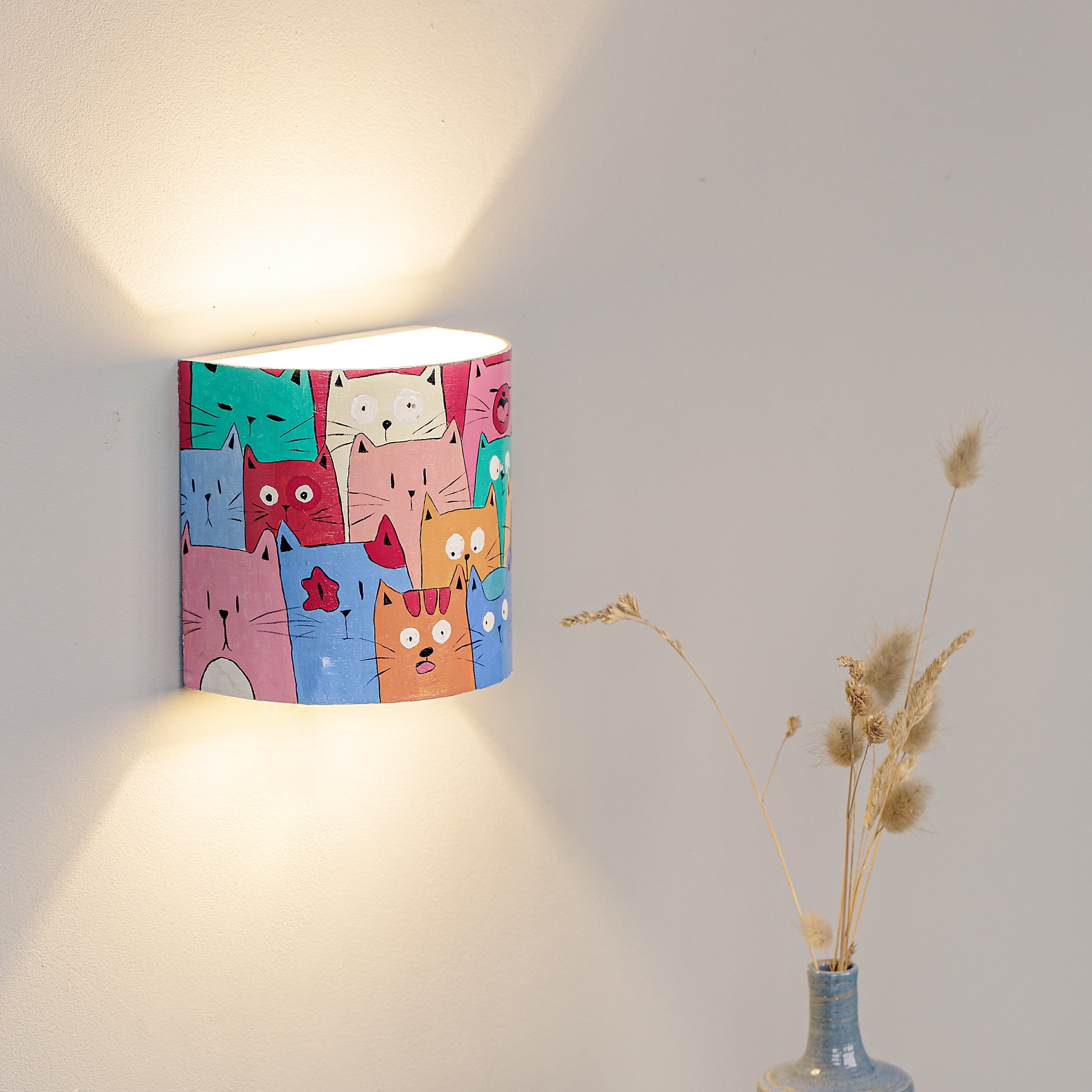 Children's night light wall sconce mounted in a nursery
