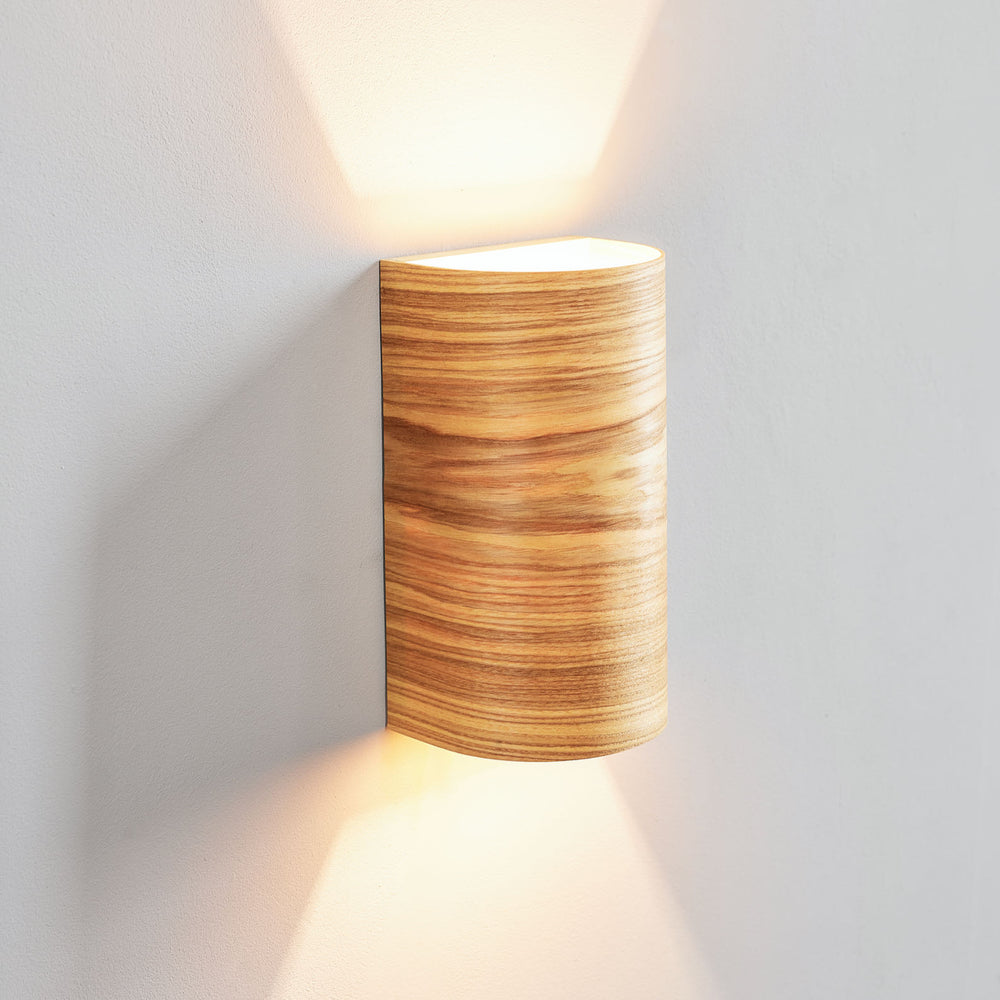 Large ash wall sconce mounted on a wall