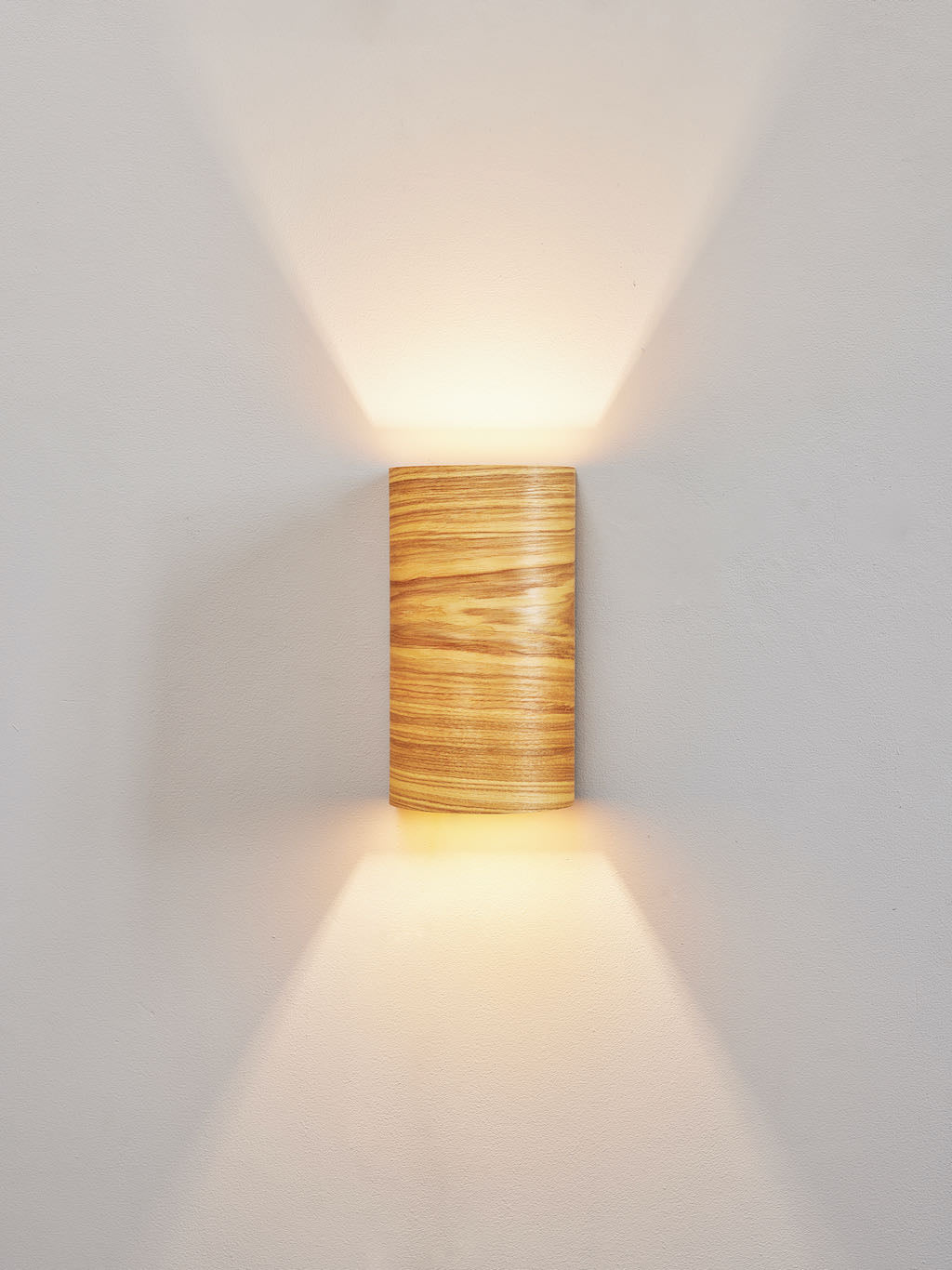 Large ash statement wall lamp with warm glow