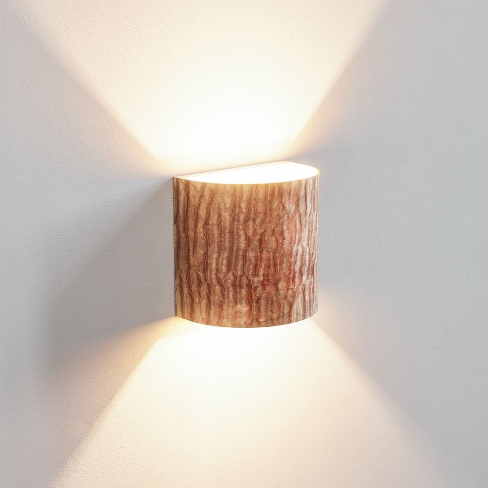 Japanese ash wall sconce mounted on a wall