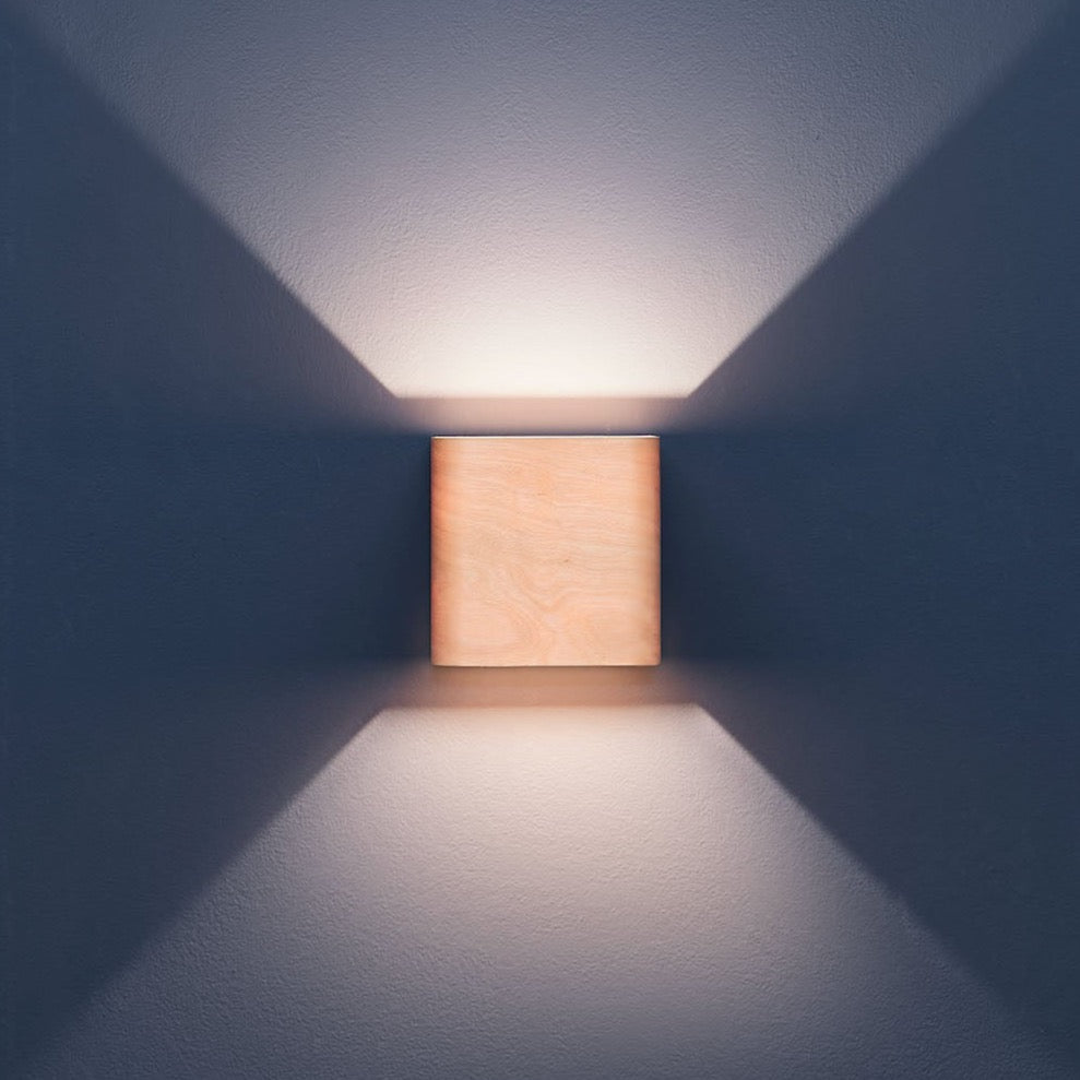 Birch wall sconce mounted in a hallway