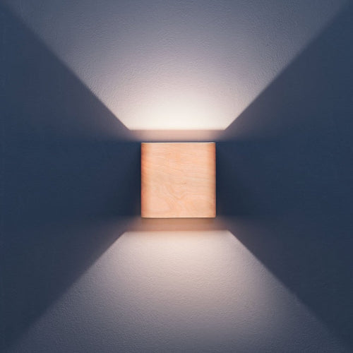 Birch wall sconce mounted in a hallway
