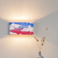 Hand-painted decorative wall-mounted lamp on a wall
