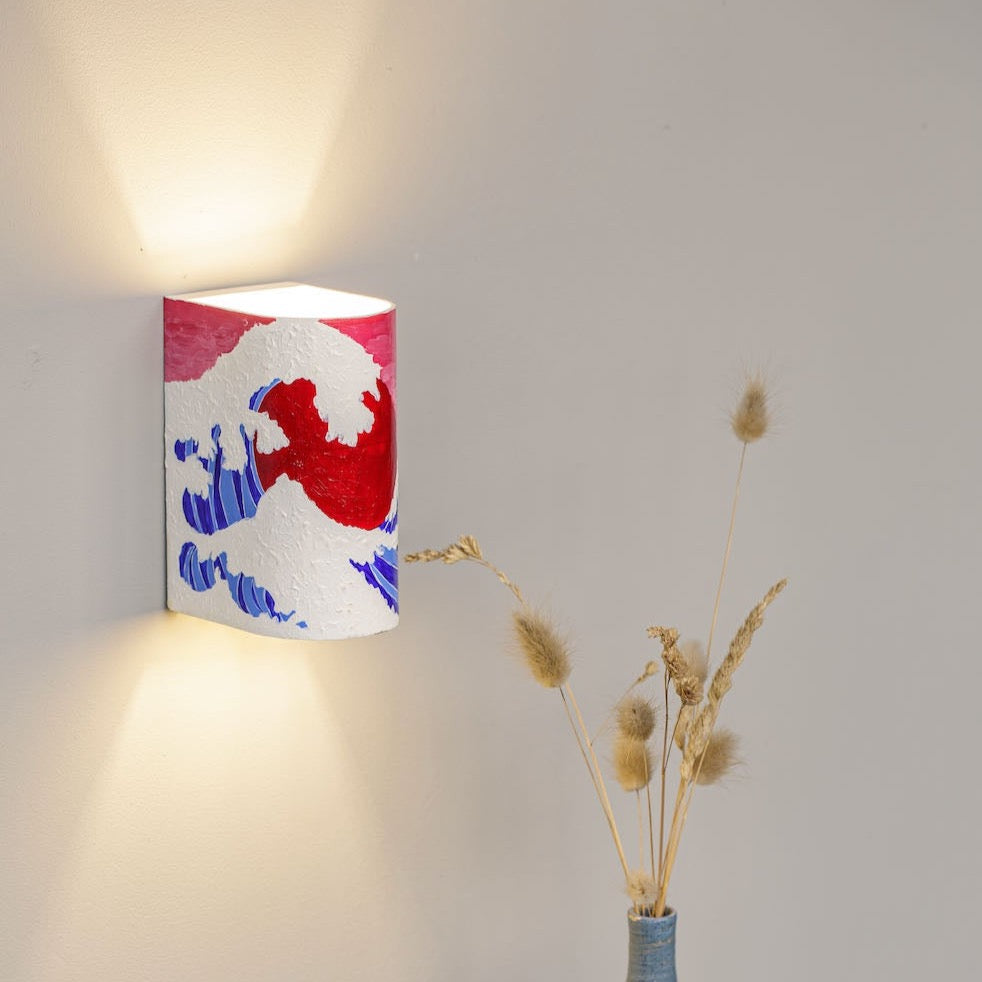 Hand-painted boho abstract wall sconce mounted on a wall