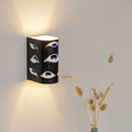 Colorful hand-painted decorative wall sconce mounted on a wall