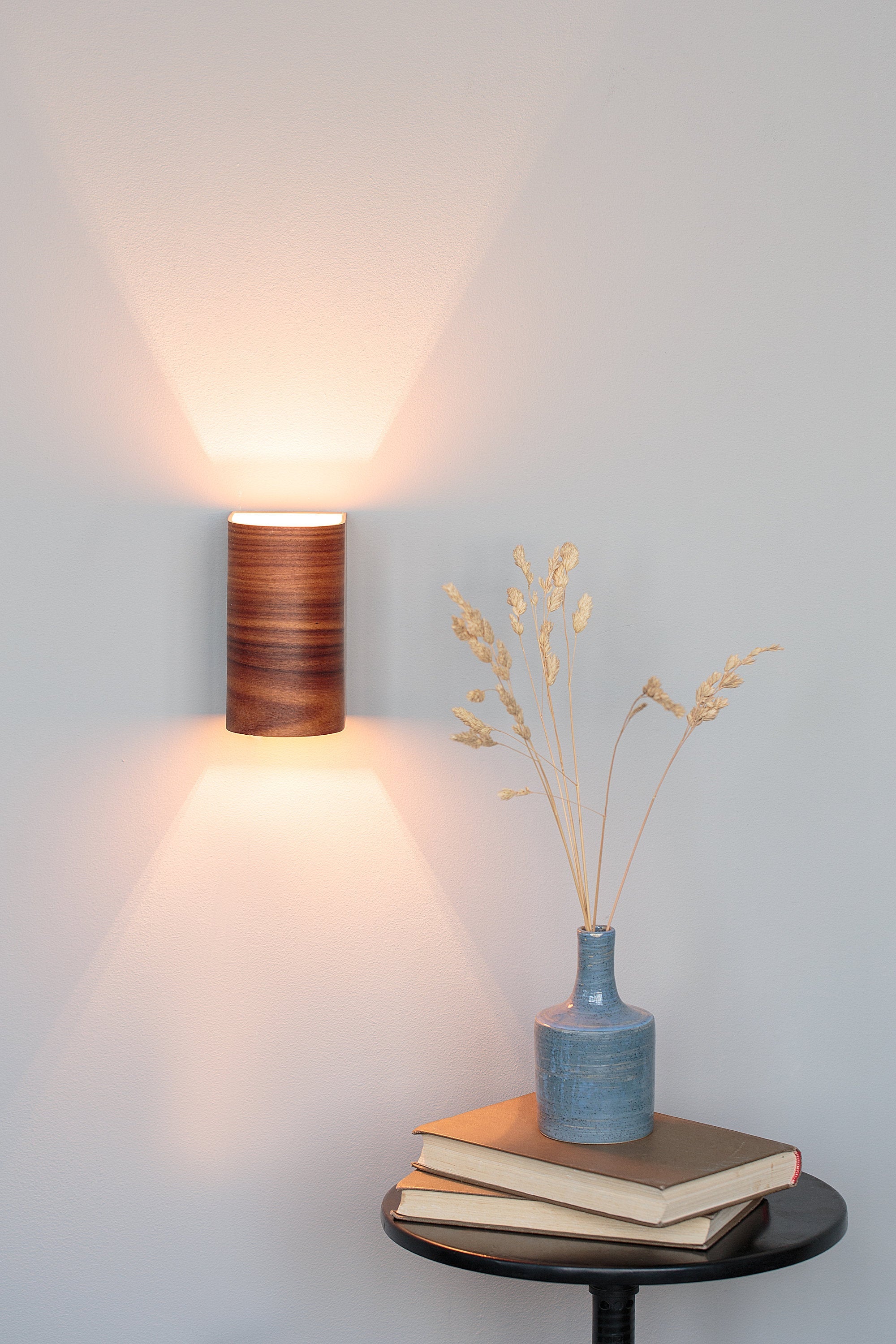 Handmade light rosewood wall sconce, front view