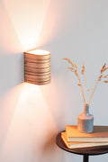 Zebrano wood wall sconce mounted on a wall
