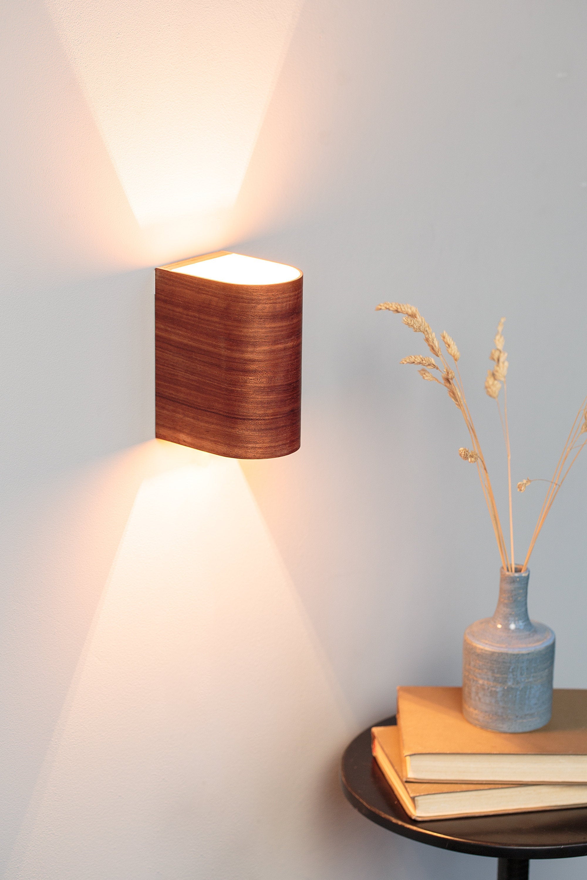 Etimoe wood wall sconce mounted on a wall